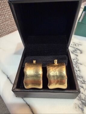 Gold Tone Wavy pierced hoop Earrings